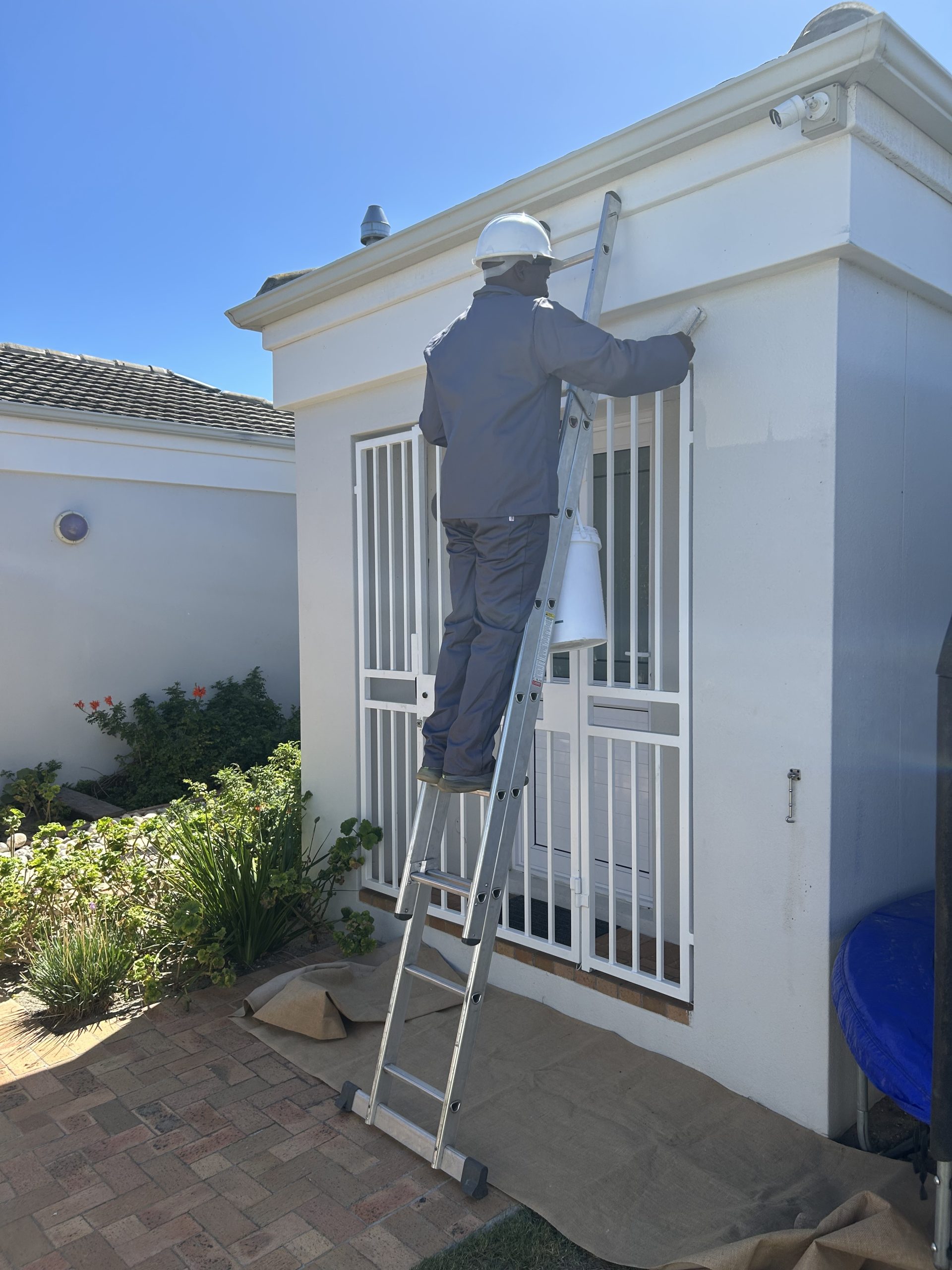 MJK house painter working on an exterior wall in Sunningdale