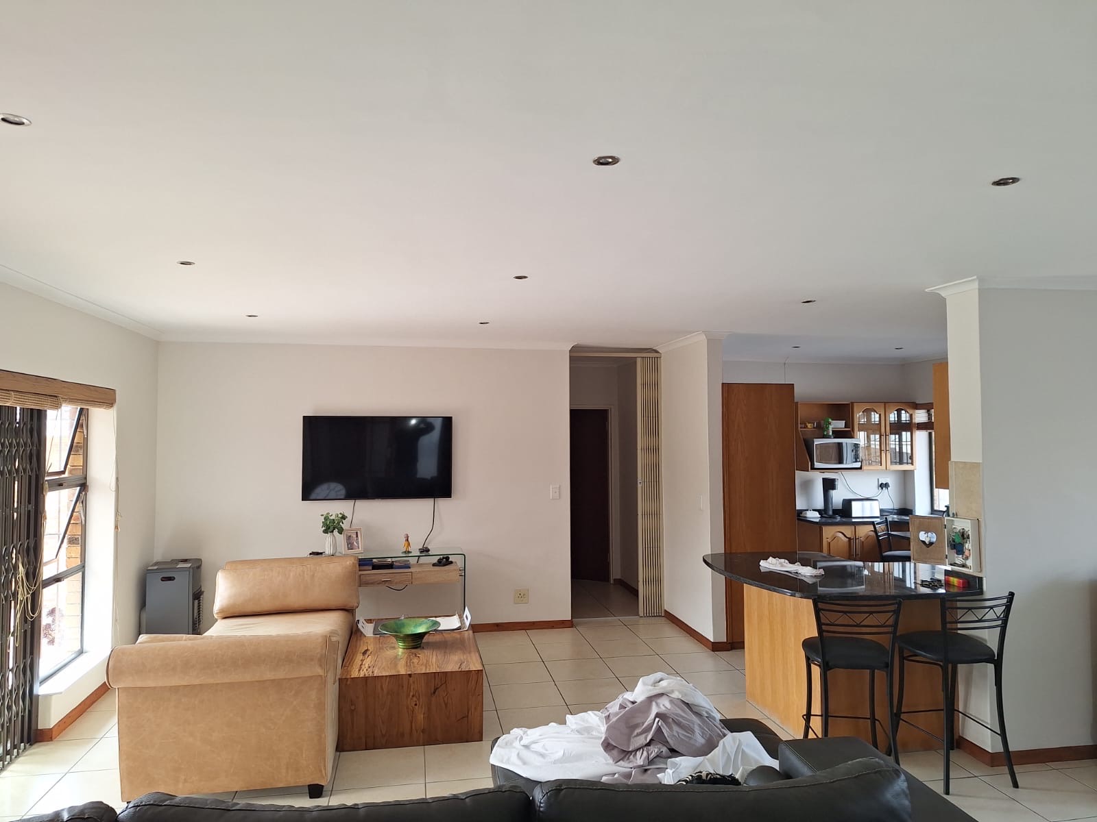 Freshly painted open-plan living area in a Durbanville home